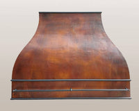 Custom hammered copper range hood ARIZONA, showcasing its elegant design and artisanal craftsmanship.