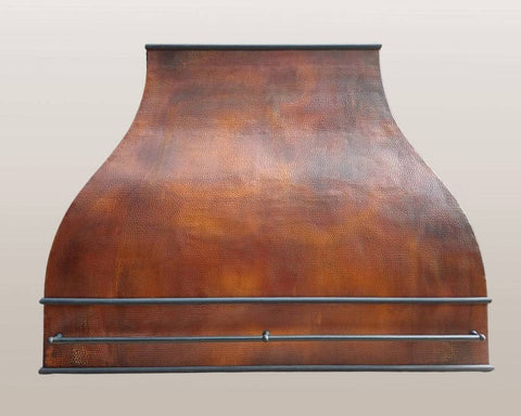 Custom hammered copper range hood ARIZONA, showcasing its elegant design and artisanal craftsmanship.