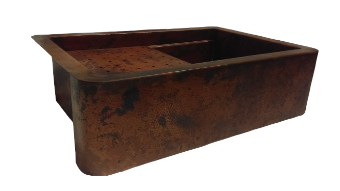 Hand-hammered copper workstation sink with round apron, featuring a spacious rectangular design and built-in accessories for enhanced kitchen functionality.