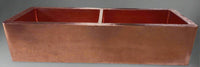 Front view of the double-bowl hammered copper kitchen sink with apron, highlighting the sink's elegant apron front and hammered finish.