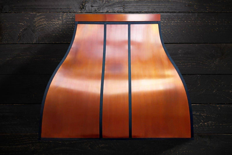 Experience the perfect blend of craftsmanship and artistry with the MATILDA Custom Copper Range Hood. Handcrafted with attention to detail, this luxurious range hood features a stunning silhouette with vertical black stripes. Ideal for adding elegance to your kitchen. Free shipping in the USA.