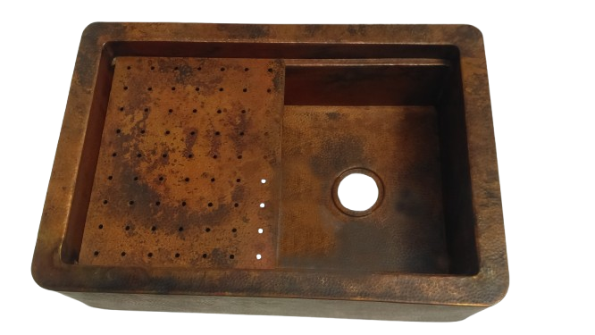 Close-up of the custom-made copper sink with a hammered texture, showcasing the detailed craftsmanship and elegant finish.