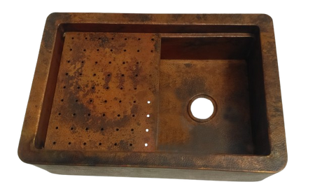 Close-up of the custom-made copper sink with a hammered texture, showcasing the detailed craftsmanship and elegant finish.