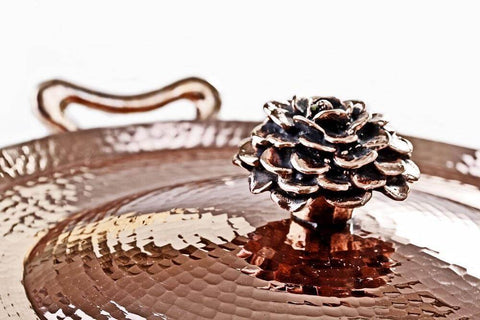 copper cookware lid with cast flower lid by Amoretti Brothers
