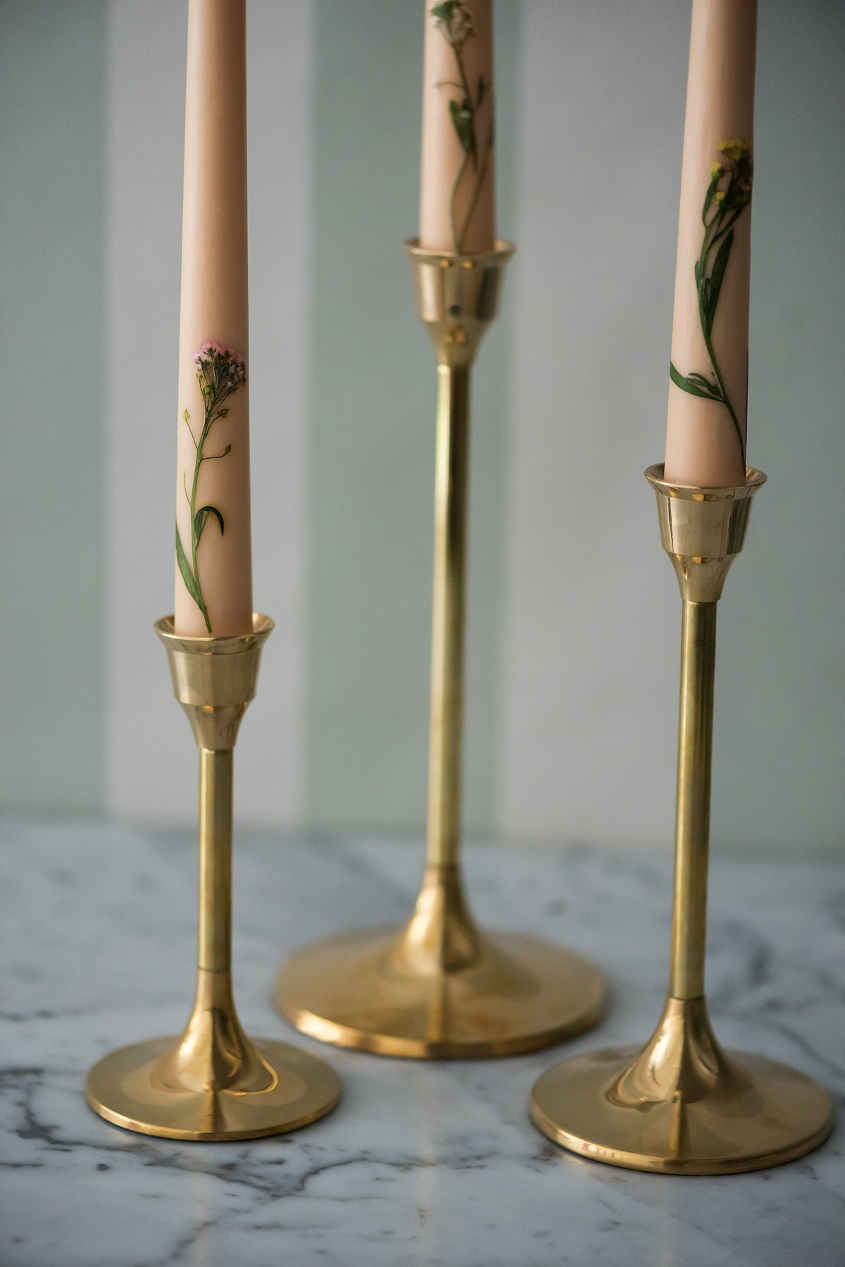 Brass candlesticks in three heights