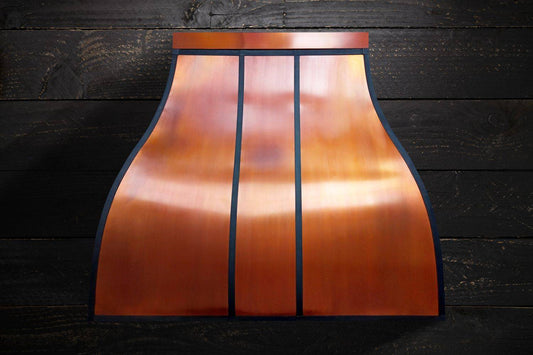 Experience the perfect blend of craftsmanship and artistry with the MATILDA Custom Copper Range Hood. Handcrafted with attention to detail, this luxurious range hood features a stunning silhouette with vertical black stripes. Ideal for adding elegance to your kitchen. Free shipping in the USA.