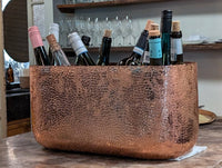 Close-up of the hammered texture on the oval copper ice bucket.