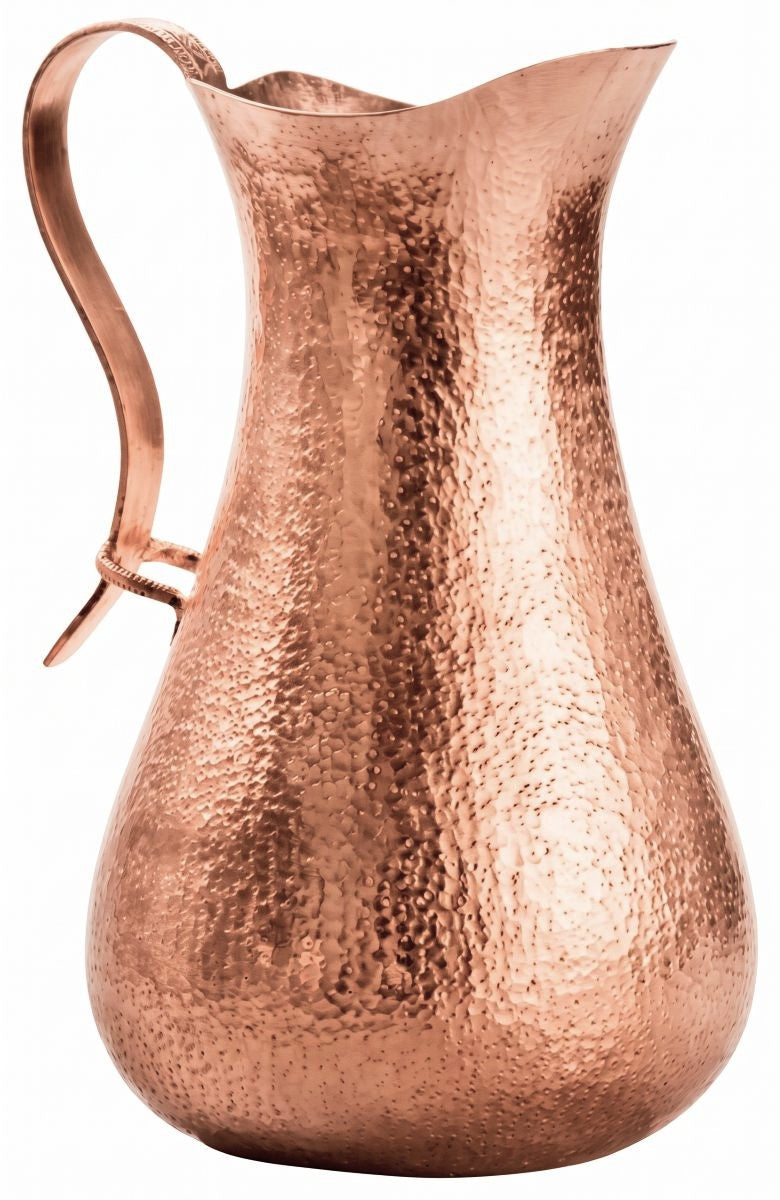A hammered copper pitcher with a curved handle and flared spout, shown on a plain white background.