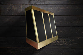 Elevate your kitchen design with the HELEN high-end brass hood, combining functionality and elegance. Perfect for kitchen designers, this luxury hood enhances your clients' spaces, creating a captivating atmosphere with its exceptional quality and stylish appeal.IN BLACK BODY AND BRASS STRAPS