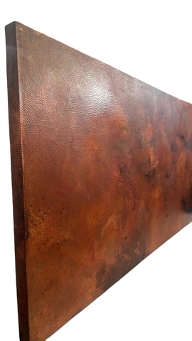 hammered copper table top with vintage patina on a side view