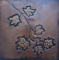 Custom copper kitchen backsplash with Italian-inspired leaf design
