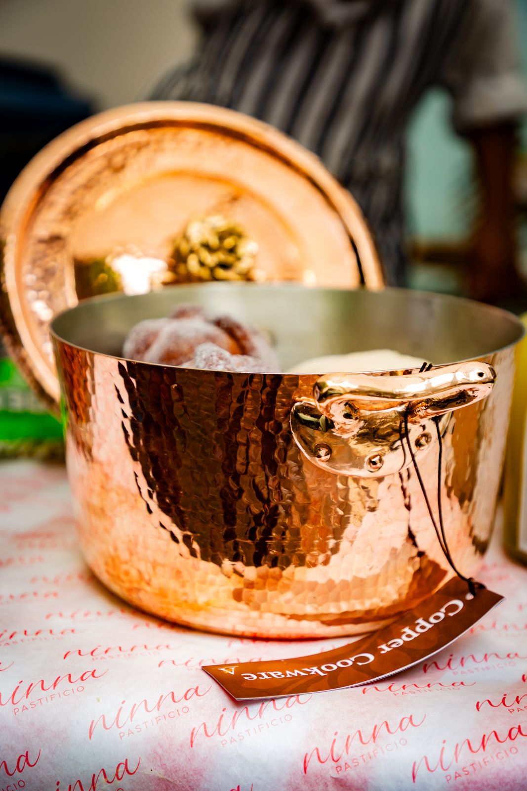 Amoretti Brothers Copper dutch oven with a lid on a table