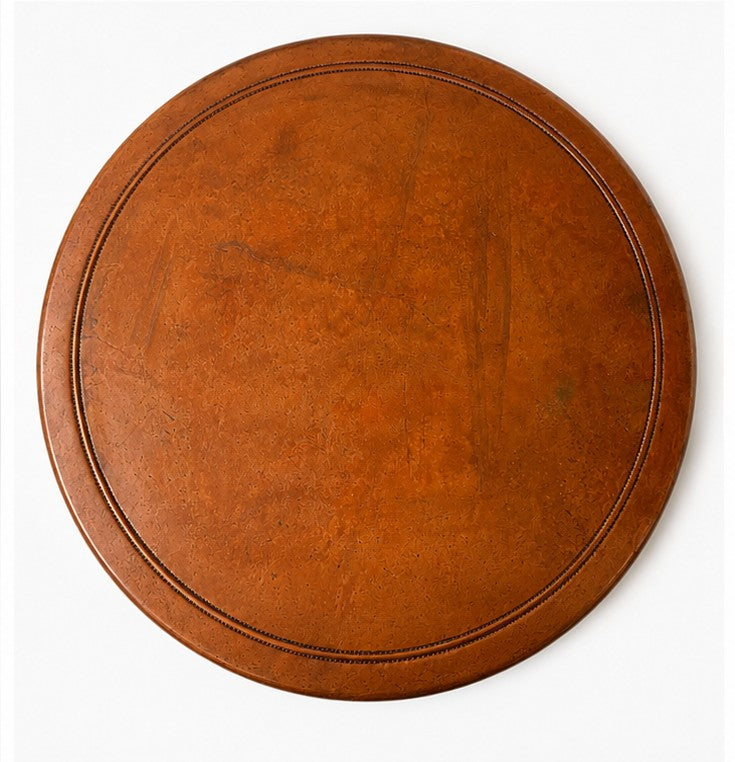 The copper side tabletop showing rich aged patina, rounded bullnose edge, and artisan raised bead border