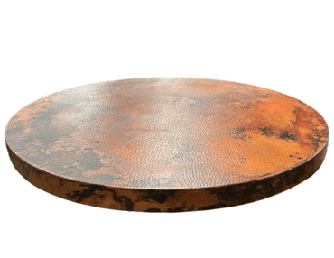 Handcrafted round hammered copper table top, 2-inch thick, adding elegance and durability to dining spaces