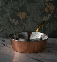 Handmade copper Windsor warming pan with brass handle, showing stainless steel-lined interior and elegant design