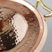 details of hammered copper cookware
