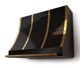 Elevate your kitchen with the EUGENE metal range hood by Amoretti Brothers in black and brass. Handmade with solid copper or brass, this luxury hood is available in different finishes and patinas, adding a touch of elegance to your kitchen design. Free shipping in the USA