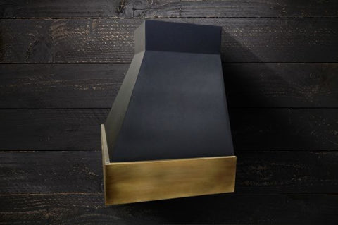 black and brass range hood by Amoretti Brothers for designer kitchen