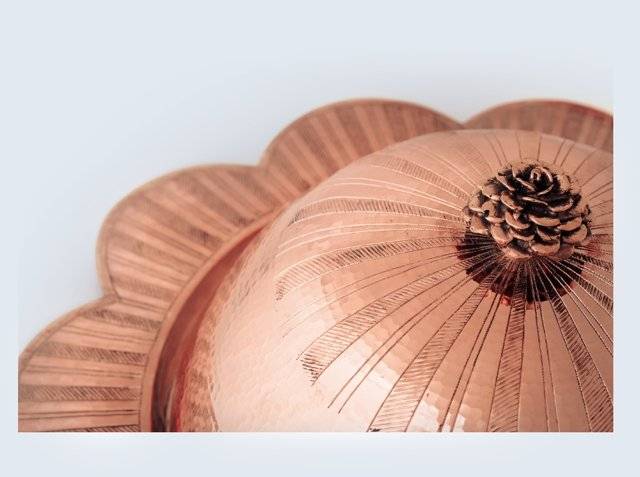 Hand-engraved vines on a copper cloche dome by Amoretti Brothers