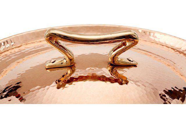 Cast bronze handle riveted by hand — Amoretti Brothers copper cookware detail