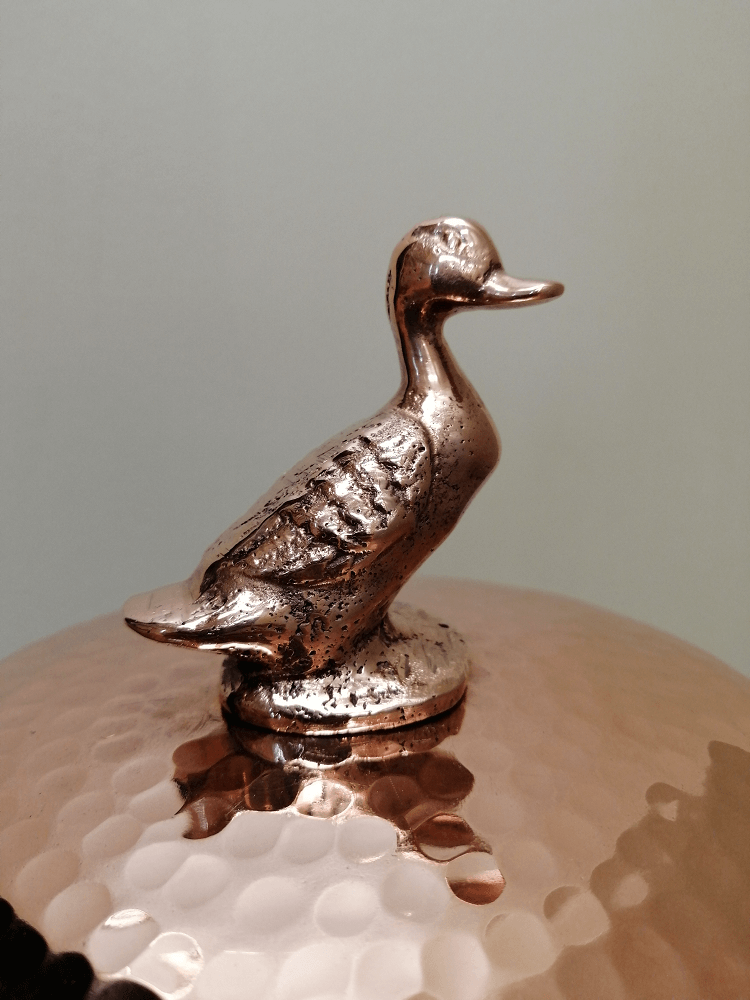 hand-hammered copper canister with duck by Amoretti Brothers