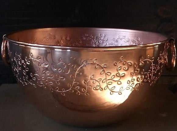 copper mixing bowl with hand-engraved leaves