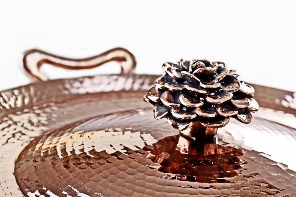 copper cookware lid with cast flower lid by Amoretti Brothers