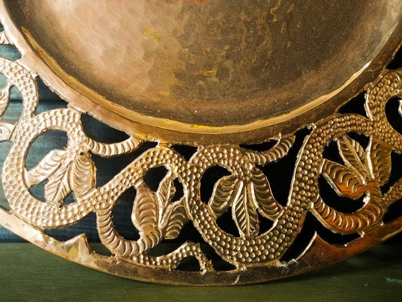 Handmade flower decor on a polished copper plate charger