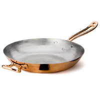 Hand-hammered to perfection by our expert coppersmiths, the 12.5” Fry Pan is a chic cooking staple.  Its gleaming copper exterior is complemented by a double layer of tin interior lining. Applied by hand by our artisans, each layer gives the inside of the pan an even protective coat that guarantees a lasting cookware piece.