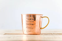 Copper liquid measuring cup with interior and exterior markings; Brass handle; 4 Cup Capacity. Add the 2.5 cup measuring cup to make it a set. Functional as well as beautiful.